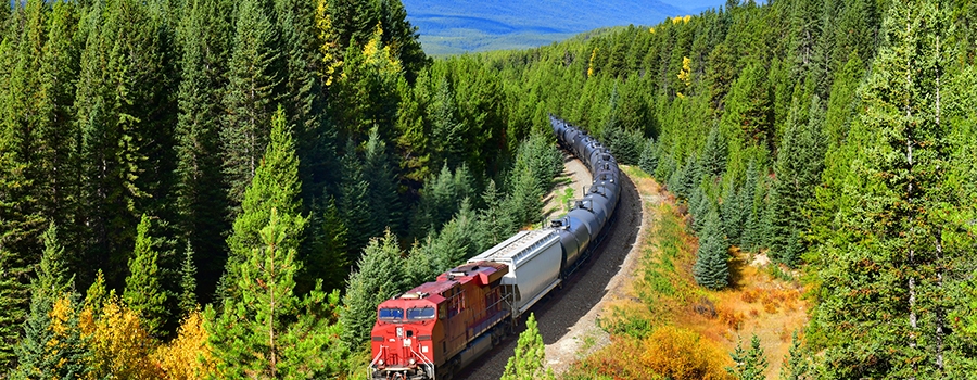 Locomotive navigates through Canadian countryside